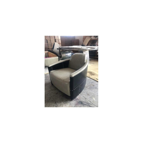 Beige Leather Accent Chair with Channel Tufting and Black Riveted Sides