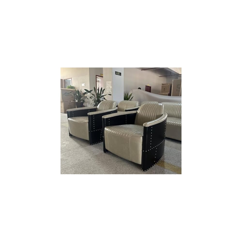 Beige Leather Accent Chair with Channel Tufting and Black Riveted Sides