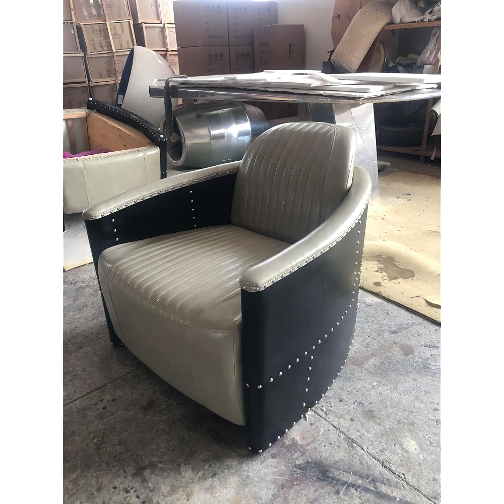 Beige Leather Accent Chair with Channel Tufting and Black Riveted Sides